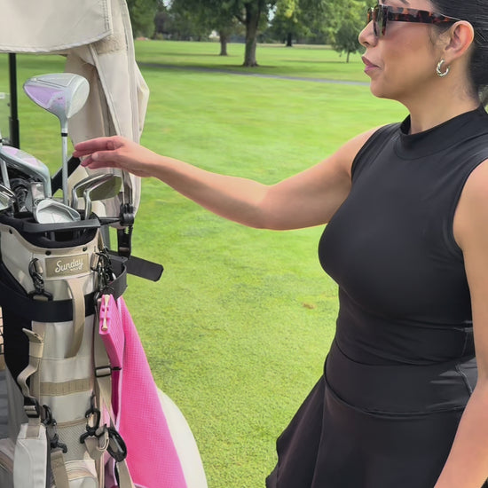Video of GTee-Magz golf tee dispenser in new pink color, spring-loaded magazine style holder for 10 tees, attaches to golf bag, stylish golf accessory for women and golfers who love colorful gear.