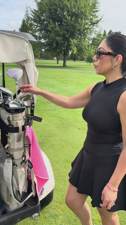 Video of GTee-Magz golf tee dispenser in new pink color, spring-loaded magazine style holder for 10 tees, attaches to golf bag, stylish golf accessory for women and golfers who love colorful gear.